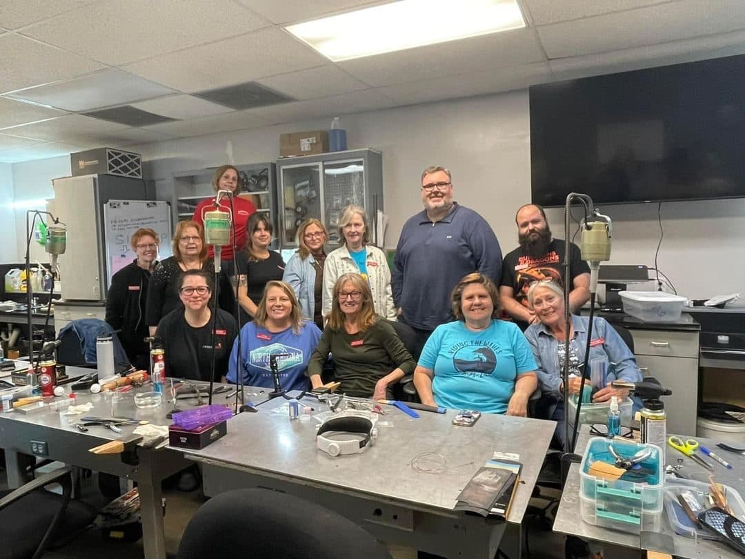 Club members gathered in the silversmithing classroom